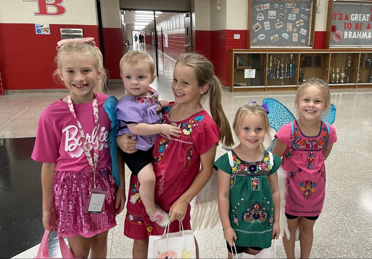 A group of young girls dressed in Halloween costumes enjoying BHS Trick-or-Treat. 